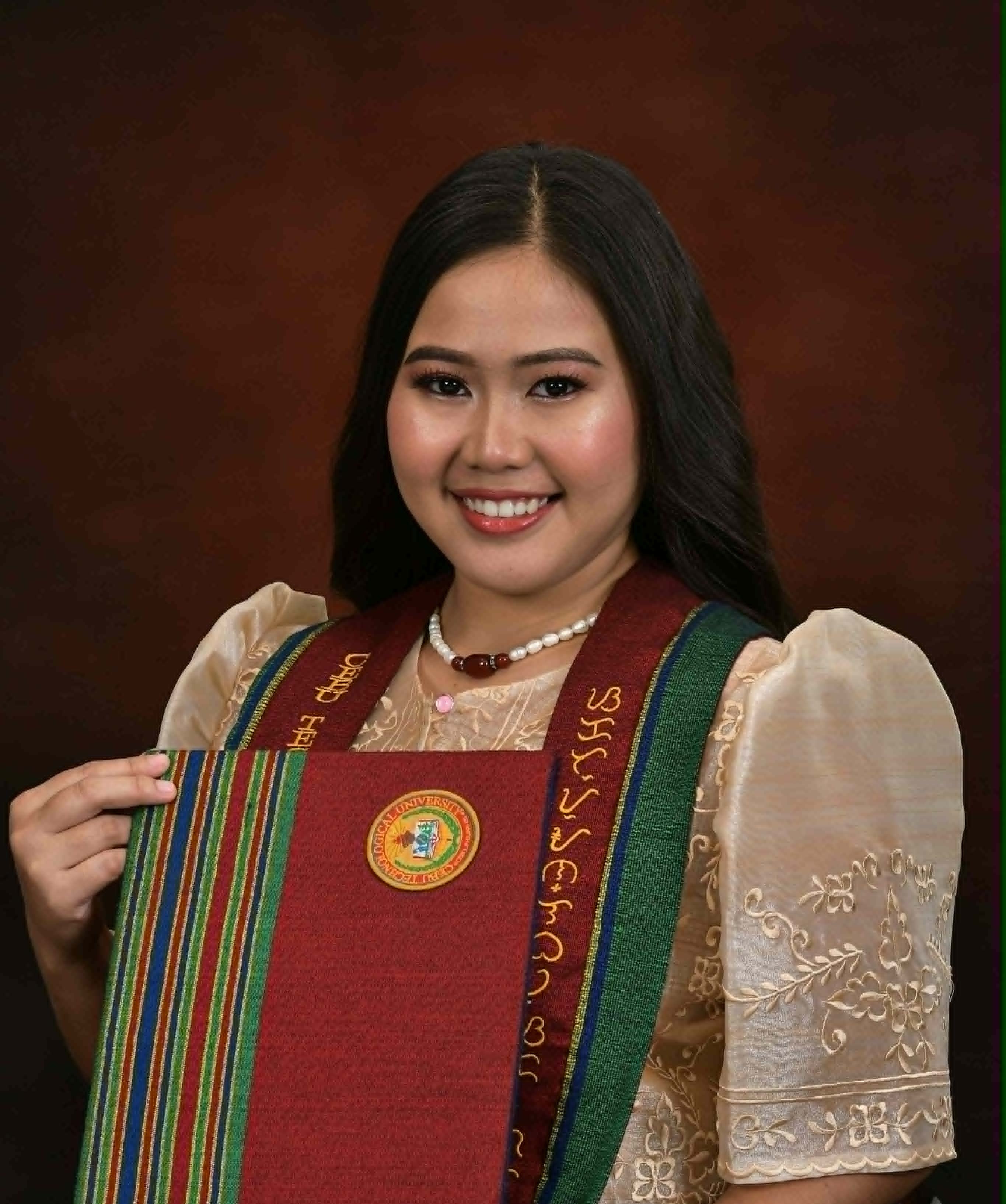 Portrait of VJ C. Salazar in graduation attire